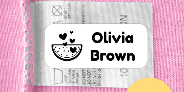 Labels4School personalised stick-in clothing label on a pink garment’s care tag, with an “As featured in The Guardian 2025” badge.